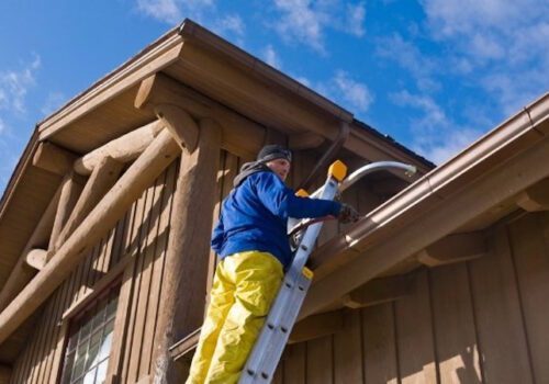 Window Cleaning & Pressure Washing Services - Squeegee Squad - checking gutters